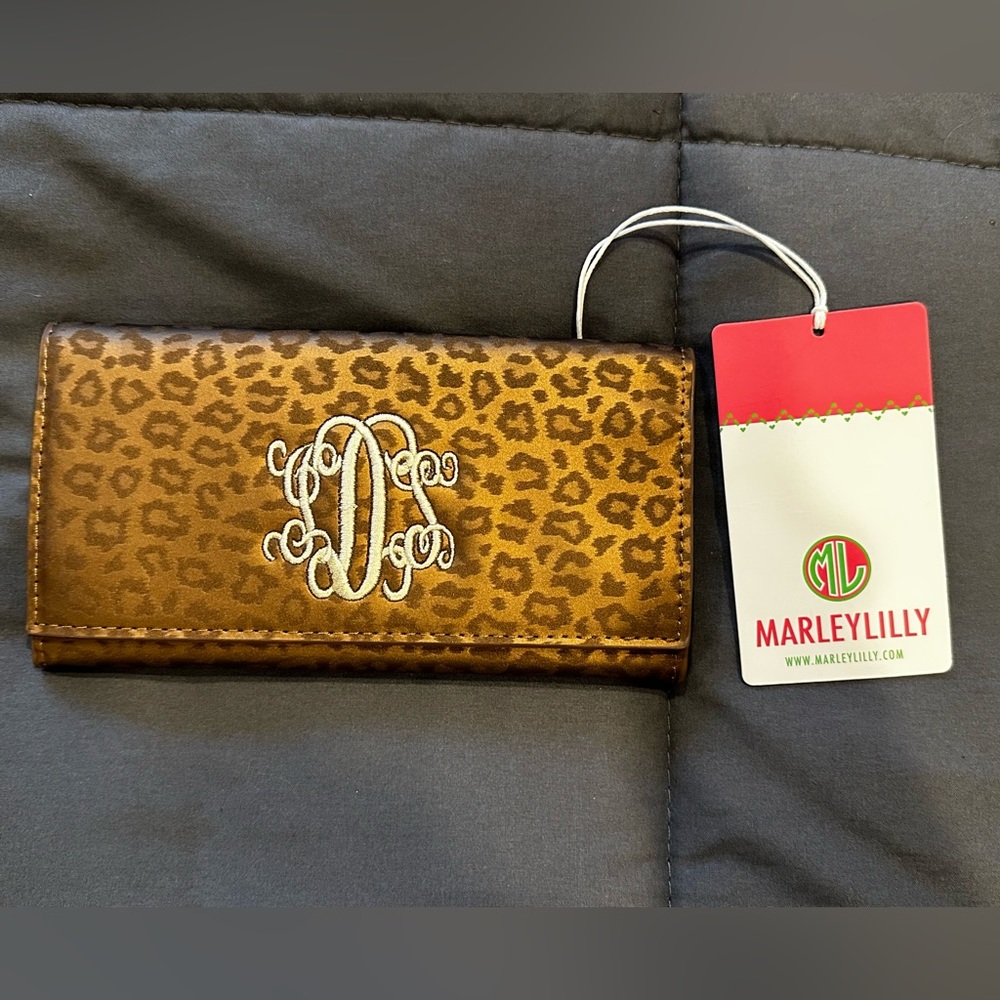 NWT Marley Lilly wallet. Metallic leopard print. Stitched with “SDS” initials.